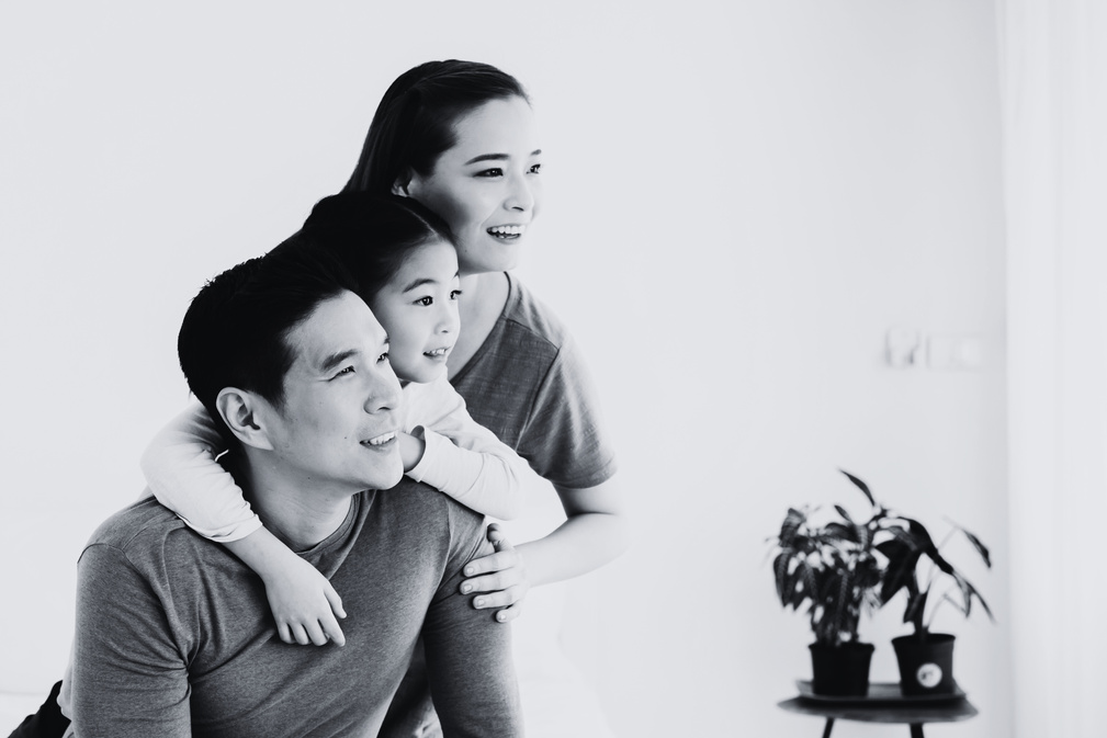 Happy Young Asian Family Looking Away Portrait