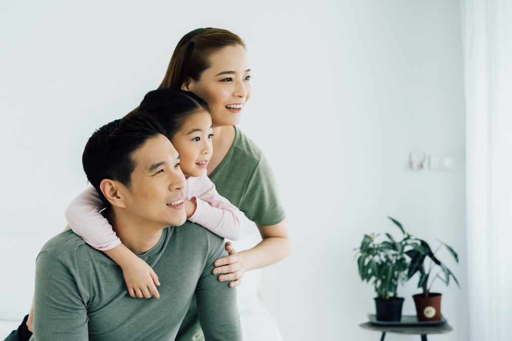 Happy Young Asian Family Looking Away Portrait